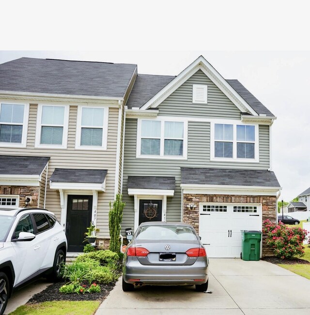 411 Triple Crown Way, Spartanburg, SC 29301 - multi unit property featuring a garage, concrete driveway, and stone siding