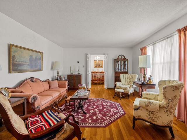 1310 Mount Zion Rd, Spartanburg, SC 29303 - living area featuring wood finished floors and a textured ceiling