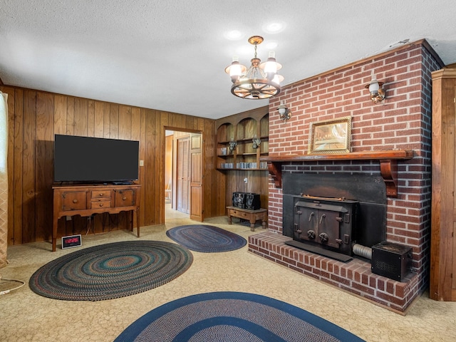 1310 Mount Zion Rd, Spartanburg, SC 29303 - living room featuring wood walls, a chandelier, a textured ceiling, and carpet