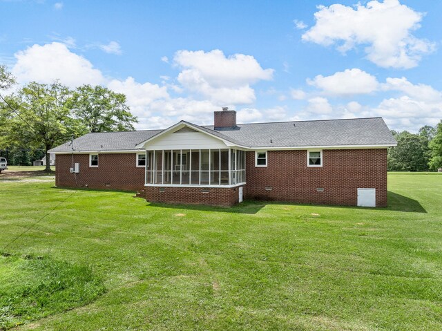 1310 Mount Zion Rd, Spartanburg, SC 29303 - rear view of property featuring a sunroom, a yard, crawl space, brick siding, and a chimney