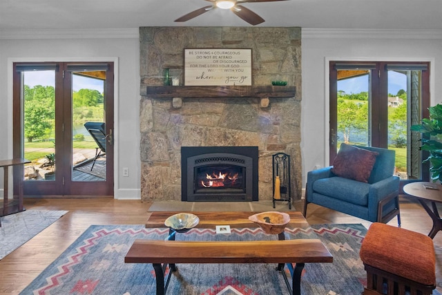 270 Watkins Rd, Campobello, SC 29322 - living area featuring crown molding, ceiling fan, a fireplace, and wood finished floors
