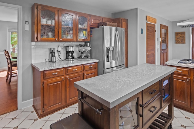 270 Watkins Rd, Campobello, SC 29322 - kitchen featuring appliances with stainless steel finishes, light countertops, a kitchen island, glass insert cabinets, and backsplash