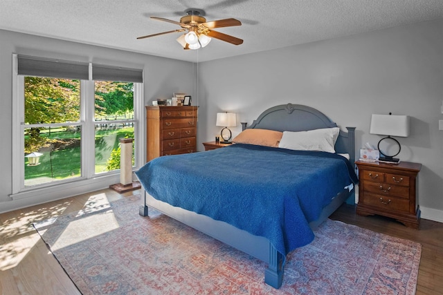 270 Watkins Rd, Campobello, SC 29322 - bedroom featuring wood finished floors, a textured ceiling, and a ceiling fan
