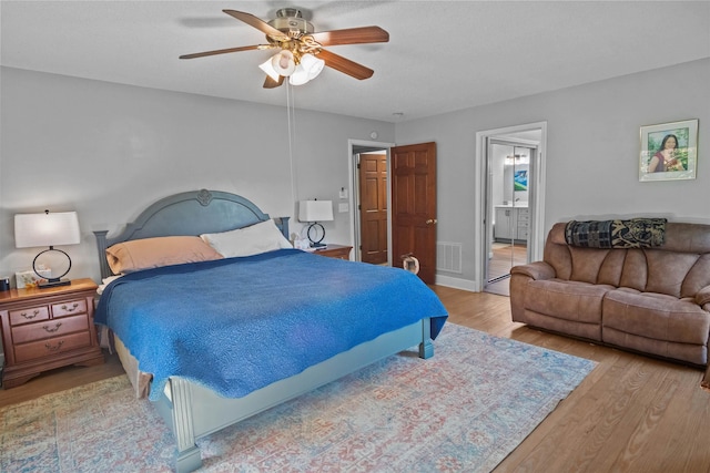 270 Watkins Rd, Campobello, SC 29322 - bedroom featuring light wood-style flooring, a ceiling fan, and ensuite bath