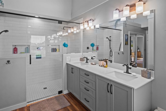 270 Watkins Rd, Campobello, SC 29322 - full bathroom featuring double vanity, a shower stall, and wood finished floors