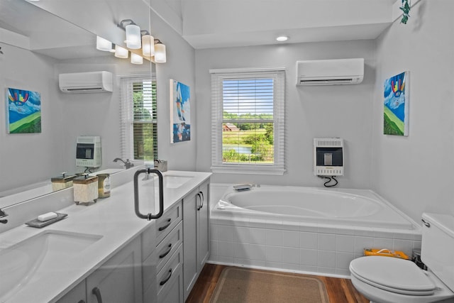 270 Watkins Rd, Campobello, SC 29322 - full bathroom featuring an AC wall unit, heating unit, wood finished floors, and double vanity