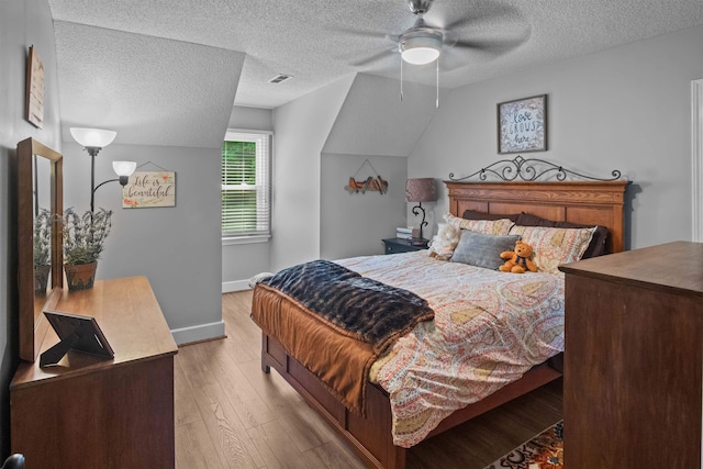 270 Watkins Rd, Campobello, SC 29322 - bedroom with light wood-style flooring, a textured ceiling, and a ceiling fan