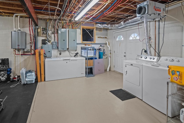 270 Watkins Rd, Campobello, SC 29322 - below grade area featuring washing machine and dryer, tankless water heater, electric panel, a heating unit, and concrete block wall