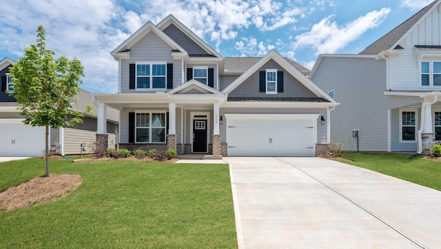 310 Fiery Rd, Mauldin, SC 29607 - craftsman-style home with driveway, a front lawn, brick siding, and board and batten siding