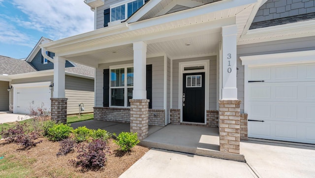 310 Fiery Rd, Mauldin, SC 29607 - doorway to property featuring a porch, a garage, a shingled roof, and concrete driveway