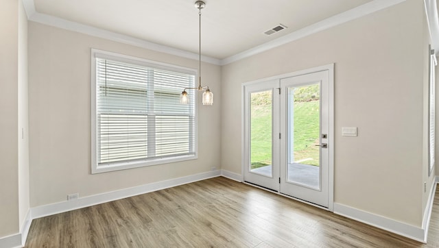 310 Fiery Rd, Mauldin, SC 29607 - unfurnished dining area with wood finished floors and crown molding