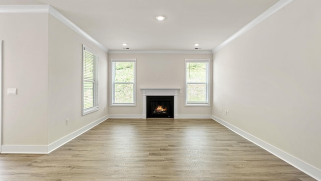 310 Fiery Rd, Mauldin, SC 29607 - unfurnished living room with crown molding, a warm lit fireplace, light wood-style flooring, and recessed lighting