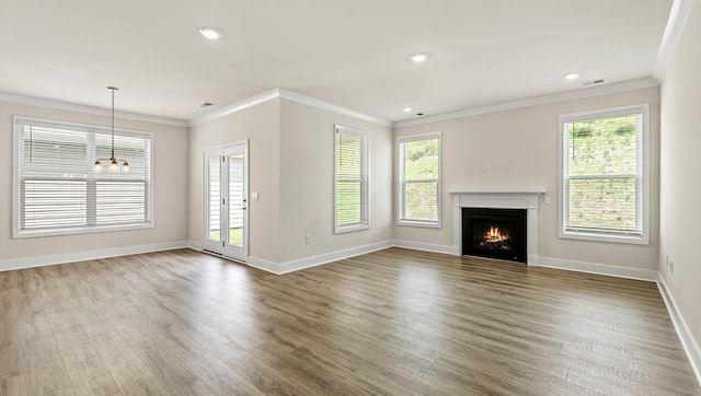 310 Fiery Rd, Mauldin, SC 29607 - unfurnished living room featuring wood finished floors, crown molding, a lit fireplace, recessed lighting, and a chandelier