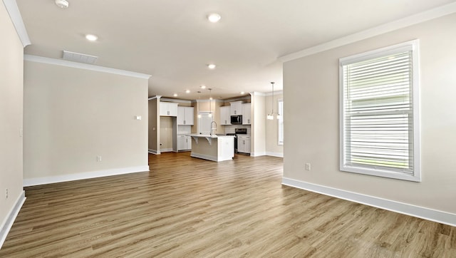 310 Fiery Rd, Mauldin, SC 29607 - unfurnished living room with ornamental molding, light wood finished floors, and recessed lighting