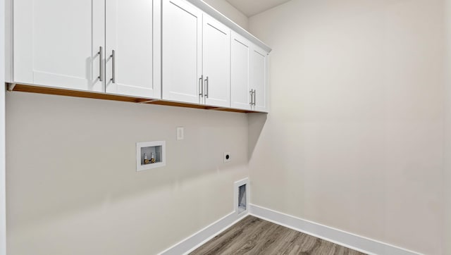 310 Fiery Rd, Mauldin, SC 29607 - washroom with cabinet space, hookup for an electric dryer, light wood-style flooring, and hookup for a washing machine