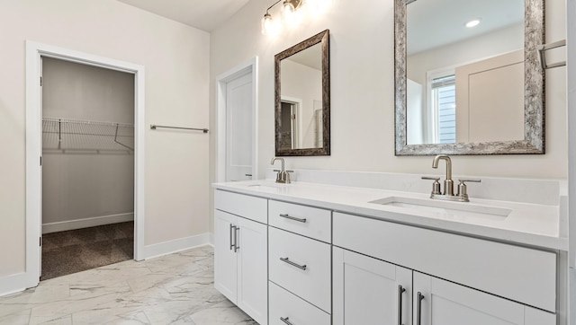 310 Fiery Rd, Mauldin, SC 29607 - full bathroom with double vanity, marble finish floors, a spacious closet, and recessed lighting