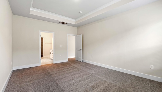 310 Fiery Rd, Mauldin, SC 29607 - unfurnished bedroom with a tray ceiling, carpet floors, ornamental molding, and connected bathroom