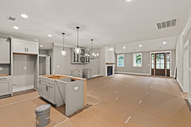 2032 Ivy Cottage Path, Boiling Springs, SC 29316 - kitchen with a large fireplace, recessed lighting, a center island, pendant lighting, and open floor plan