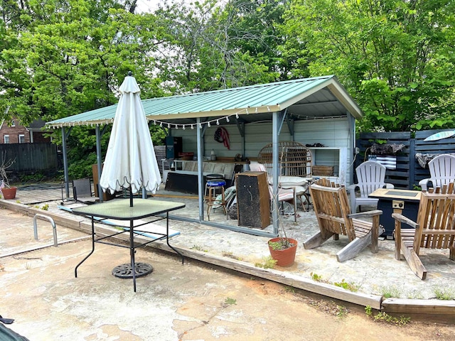 510 E Earle St, Landrum, SC 29356 - view of patio with an outdoor fire pit and an outbuilding