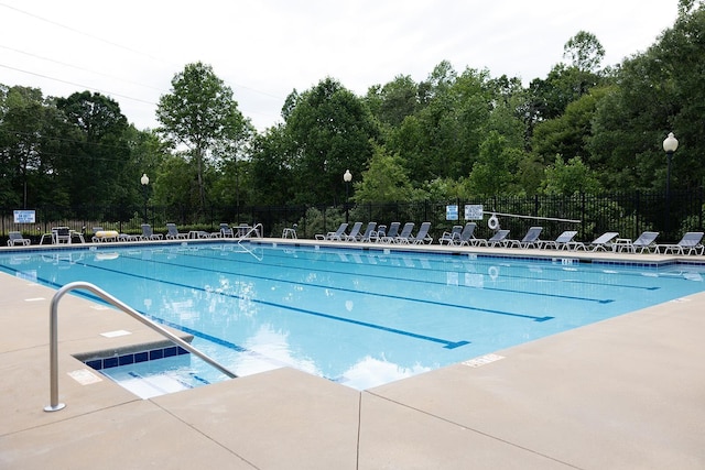 413 N Sweetwater Hills Dr, Moore, SC 29369 - community pool with a patio and view of wooded area