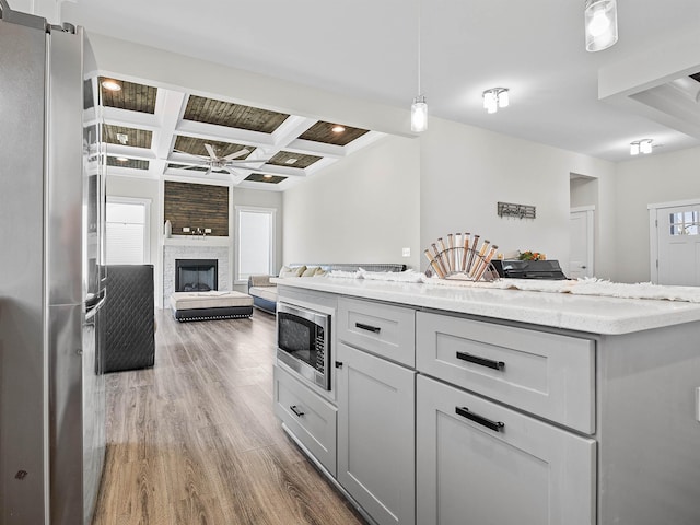 433 Josie Way, Boiling Springs, SC 29316 - kitchen with stainless steel appliances, coffered ceiling, wood finished floors, beam ceiling, and a ceiling fan