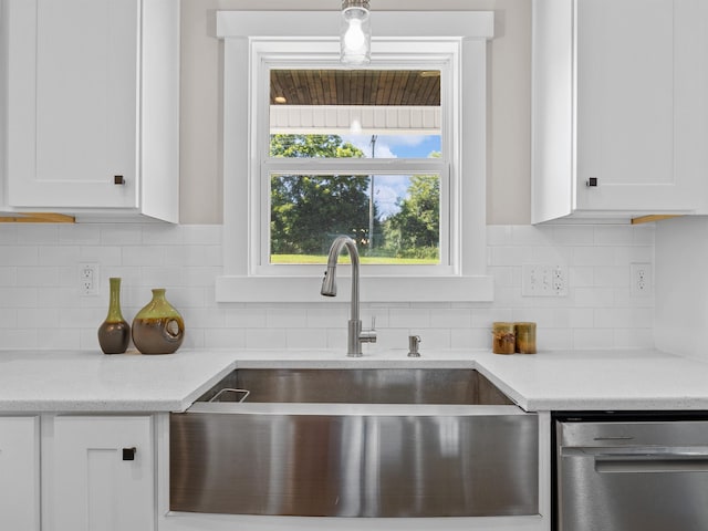 433 Josie Way, Boiling Springs, SC 29316 - kitchen featuring stainless steel dishwasher, white cabinetry, decorative backsplash, and light stone counters