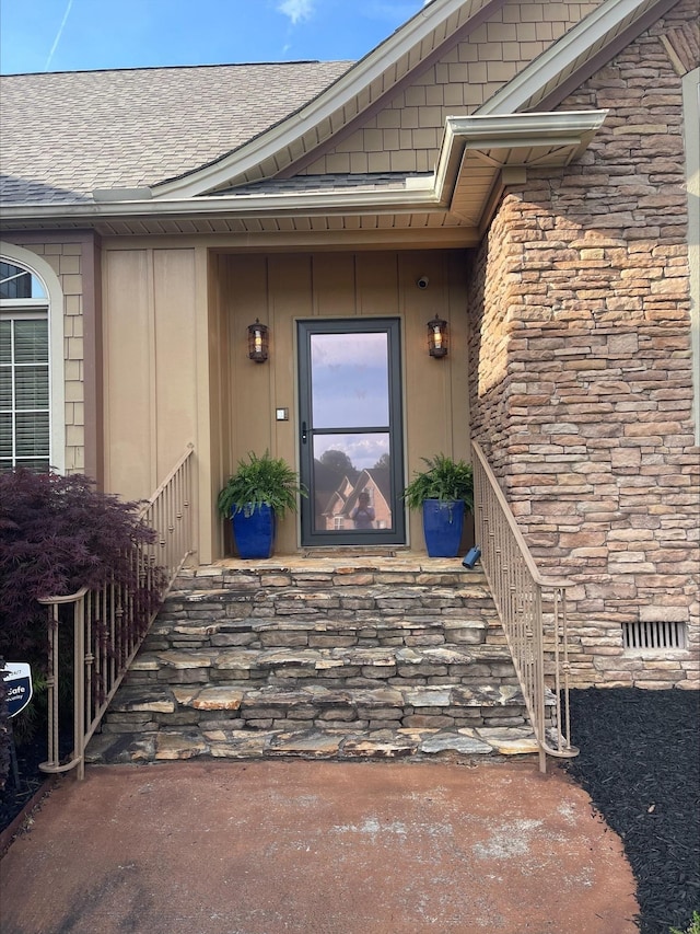 204 Tuscan Ridge Trl, Inman, SC 29349 - doorway to property with a shingled roof and stone siding