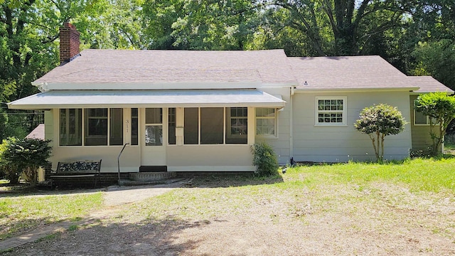 311 Hart St, Union, SC 29379 - view of front facade with a chimney and a sunroom