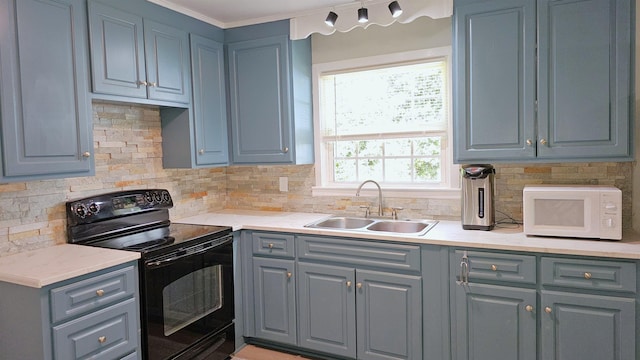 311 Hart St, Union, SC 29379 - kitchen with electric range, white microwave, gray cabinetry, light countertops, and crown molding