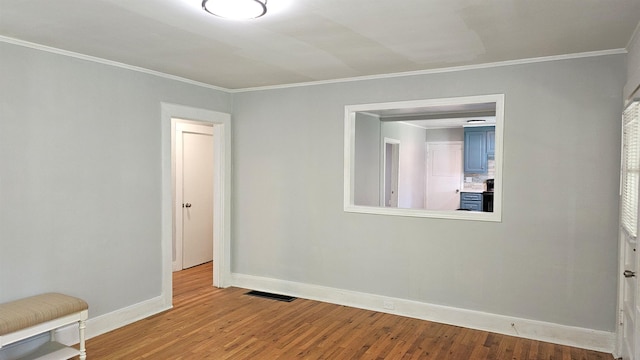 311 Hart St, Union, SC 29379 - empty room featuring wood finished floors and crown molding