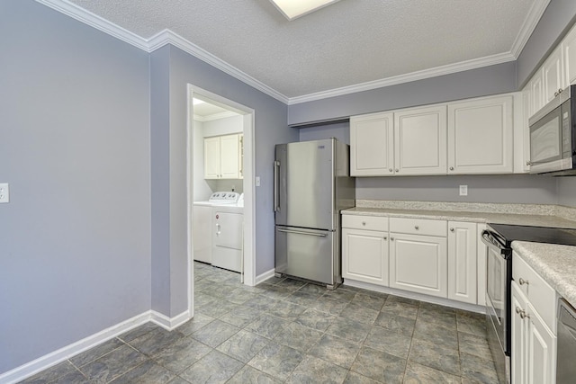 15 Arbours W Ln, Moore, SC 29369 - kitchen featuring appliances with stainless steel finishes, washing machine and clothes dryer, white cabinetry, light countertops, and crown molding