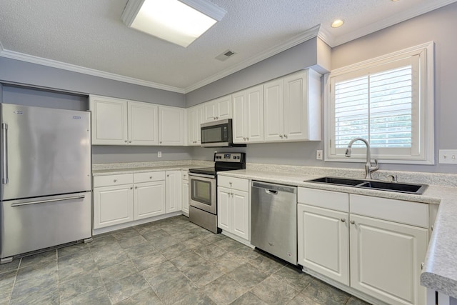15 Arbours W Ln, Moore, SC 29369 - kitchen featuring appliances with stainless steel finishes, a textured ceiling, white cabinetry, light countertops, and crown molding