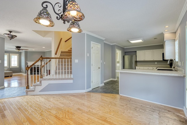 15 Arbours W Ln, Moore, SC 29369 - kitchen featuring freestanding refrigerator, ornamental molding, a textured ceiling, light countertops, and wood finished floors
