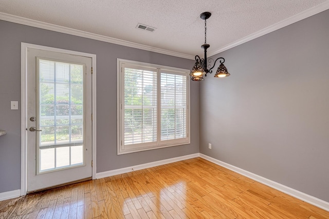 15 Arbours W Ln, Moore, SC 29369 - spare room with a chandelier, a textured ceiling, ornamental molding, and light wood finished floors