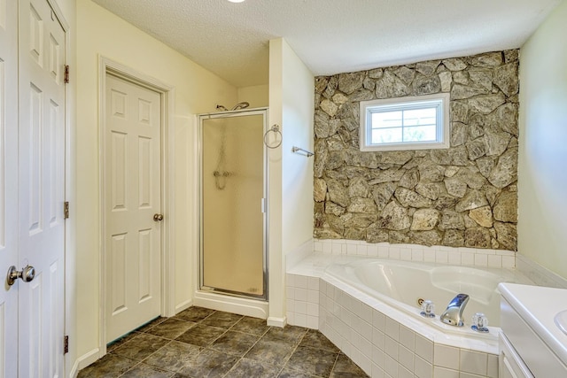 15 Arbours W Ln, Moore, SC 29369 - full bathroom featuring a bath, a stall shower, and a textured ceiling
