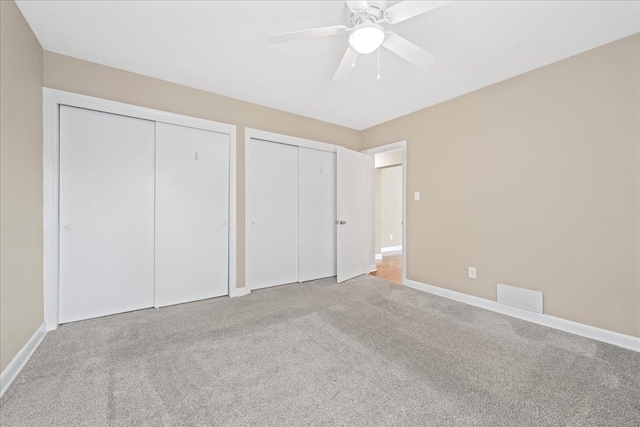 222 Woodview Ave, Spartanburg, SC 29306 - unfurnished bedroom with two closets, carpet flooring, and ceiling fan
