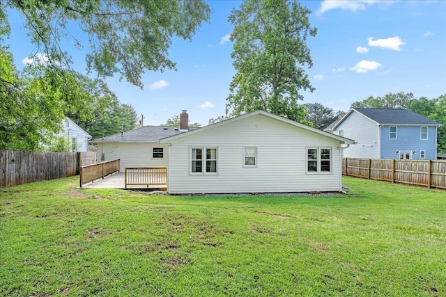 222 Woodview Ave, Spartanburg, SC 29306 - back of house with a fenced backyard, a wooden deck, and a chimney