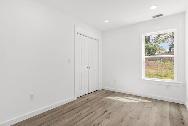 139 Carolina Ave, Spartanburg, SC 29306 - unfurnished bedroom with light wood-style flooring, a closet, and recessed lighting