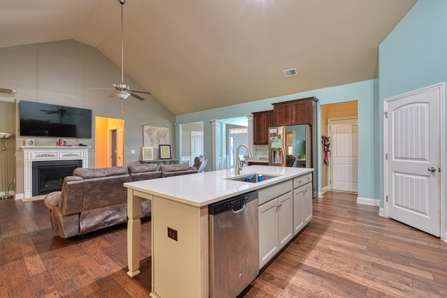 202 Buxton Ct, Easley, SC 29642 - kitchen with stainless steel dishwasher, a ceiling fan, light countertops, high vaulted ceiling, and a fireplace