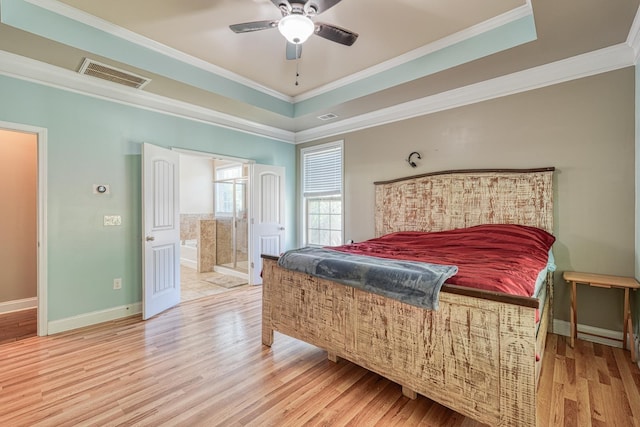 202 Buxton Ct, Easley, SC 29642 - bedroom with light wood finished floors, crown molding, a tray ceiling, connected bathroom, and ceiling fan