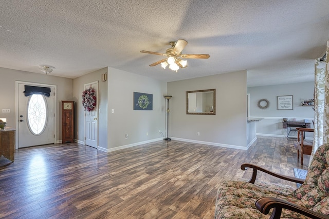 103 Cheyenne Ridge Trl, Campobello, SC 29322 - foyer featuring a ceiling fan, a textured ceiling, and wood finished floors