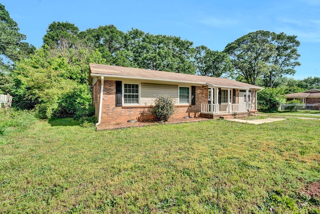 211 Skyline Rd, Greer, SC 29651 - ranch-style home with a porch, brick siding, and a front lawn
