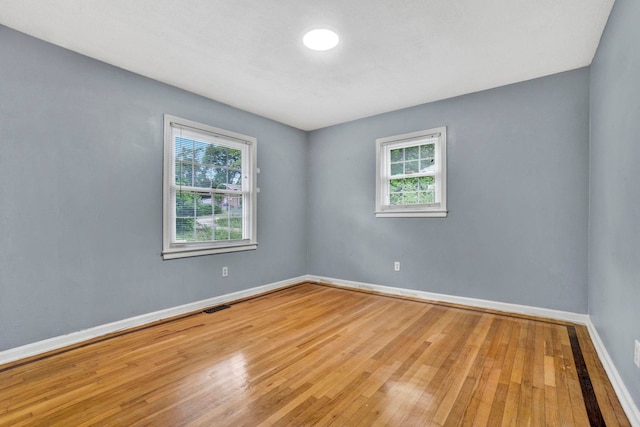 211 Skyline Rd, Greer, SC 29651 - empty room featuring healthy amount of natural light and hardwood / wood-style flooring