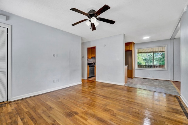 211 Skyline Rd, Greer, SC 29651 - unfurnished living room with light wood-style flooring and ceiling fan