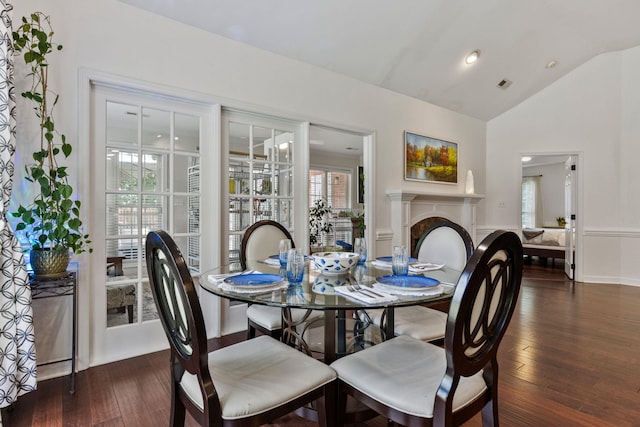 413 Rambling Rose Way, Moore, SC 29369 - dining space with vaulted ceiling, healthy amount of natural light, wood finished floors, and a fireplace