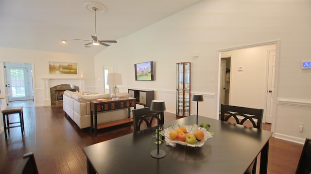 413 Rambling Rose Way, Moore, SC 29369 - dining room featuring vaulted ceiling, ceiling fan, a high end fireplace, and dark wood-style flooring