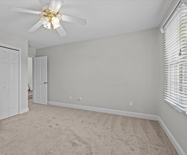 155 Lake Park Dr, Spartanburg, SC 29301 - unfurnished bedroom with carpet floors, a closet, and a ceiling fan