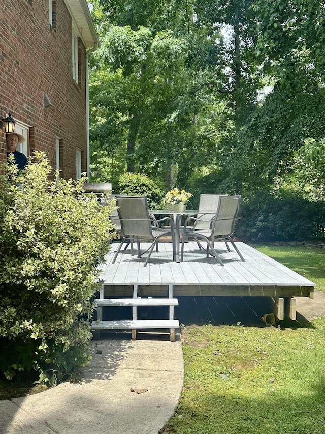 155 Lake Park Dr, Spartanburg, SC 29301 - wooden terrace featuring outdoor dining area, a lawn, and view of scattered trees