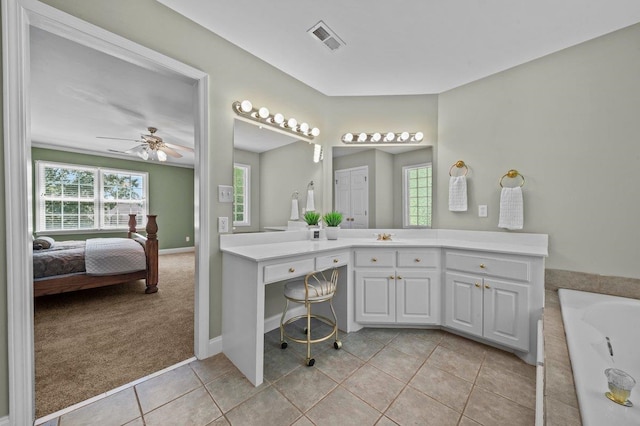 155 Lake Park Dr, Spartanburg, SC 29301 - full bathroom featuring a tub to relax in, vanity, connected bathroom, tile patterned flooring, and a ceiling fan