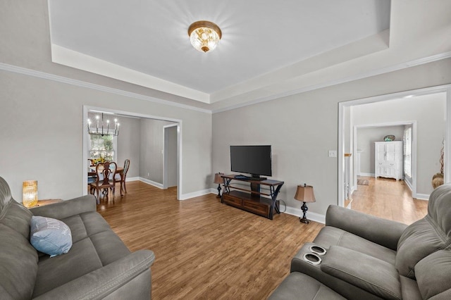 155 Lake Park Dr, Spartanburg, SC 29301 - living area with a raised ceiling, a chandelier, and light wood-style floors